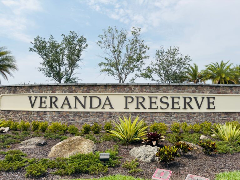 Dash Hernandez, realtor, at the entrance of Veranda Preserve, a Lennar community in Port St. Lucie, FL