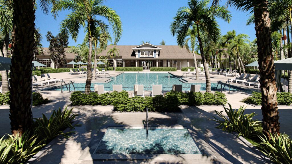 Resort-style pool and clubhouse at Four Seasons at Wylder 55+ community in Port St. Lucie, surrounded by palm trees, lounge chairs, and umbrellas