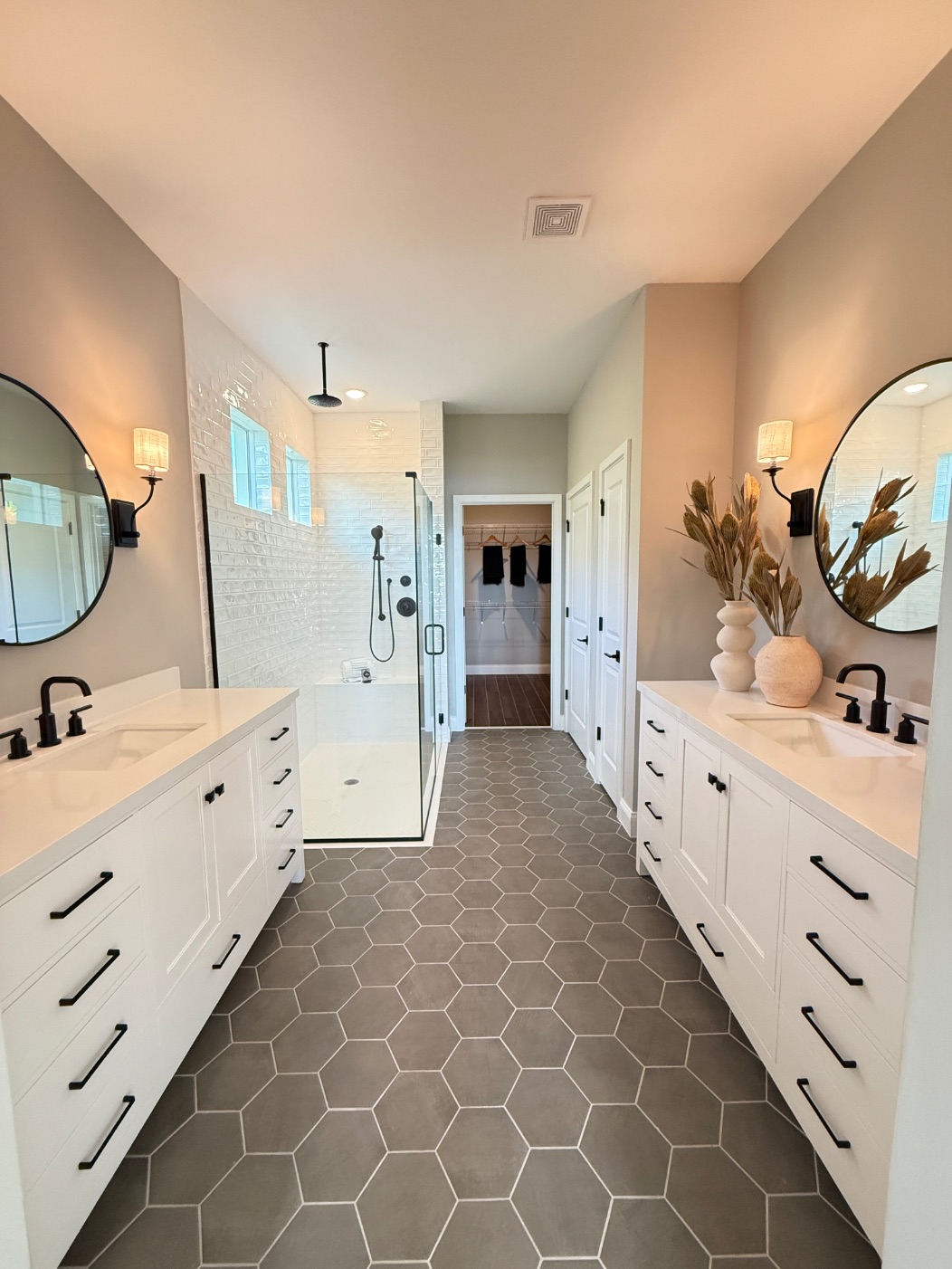 Astaire Bathroom Design | Four Seasons at Wylder Astaire Model Bathroom Design - Modern bathroom with walk-in closet access at Four Seasons at Wylder by K. Hovnanian, Port St. Lucie